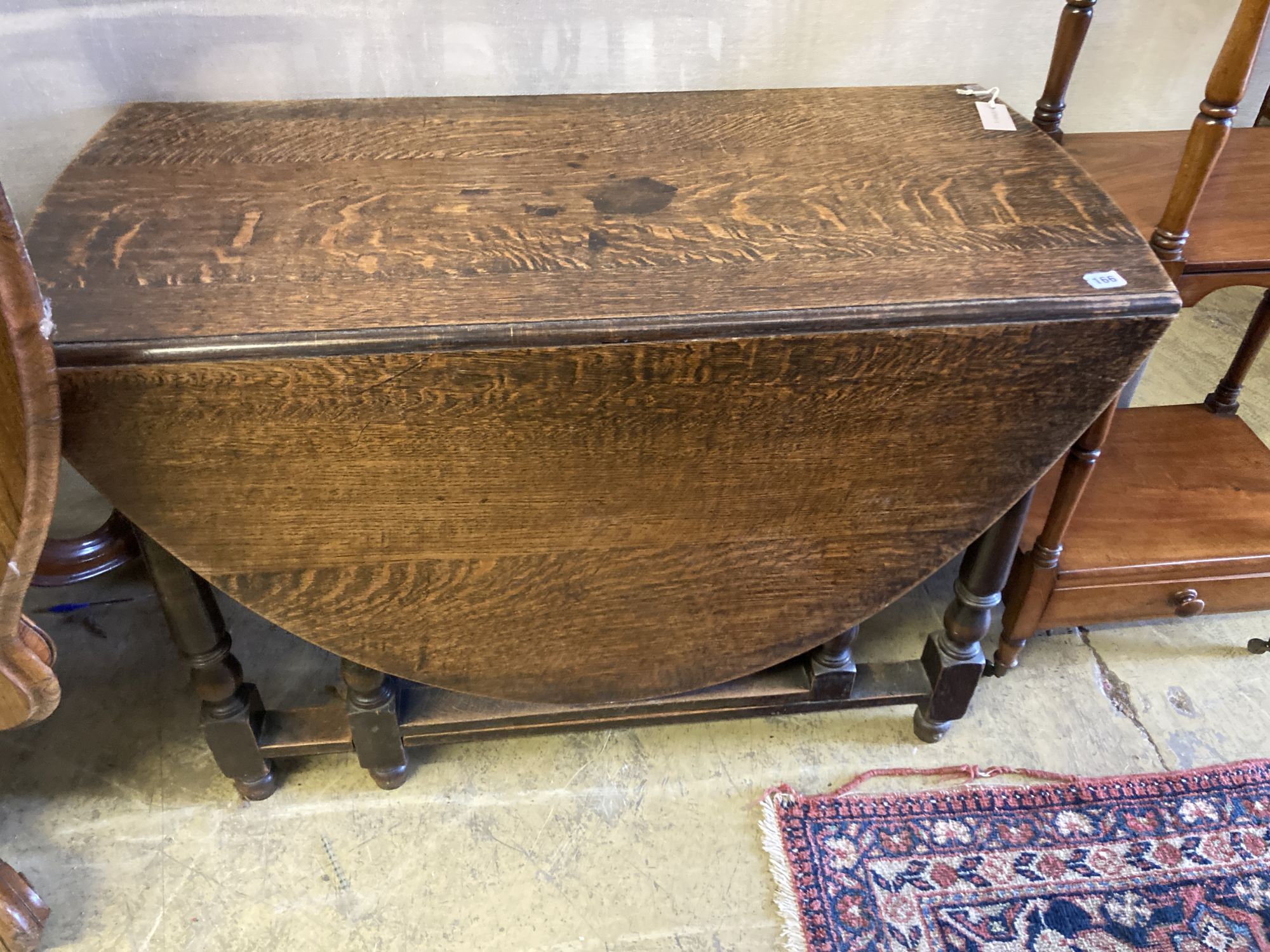 An oak gateleg dining table, length 106cm, depth 50cm, height 73cm